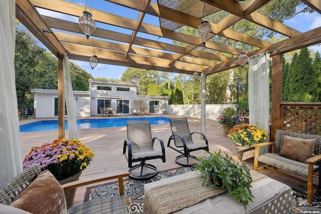 exterior space featuring a pergola, an outdoor hangout area, and a fenced in pool