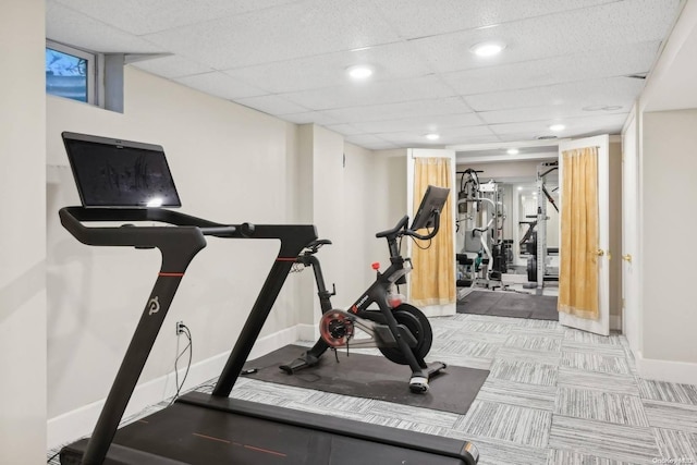 workout room featuring a drop ceiling