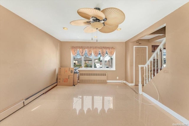 interior space featuring ceiling fan, radiator heating unit, and baseboard heating