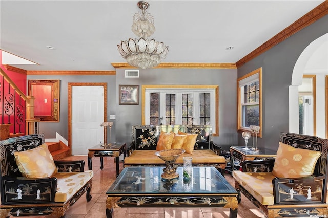 tiled living room with crown molding and an inviting chandelier