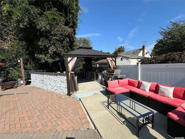 view of patio with a gazebo, area for grilling, an outdoor living space, and grilling area