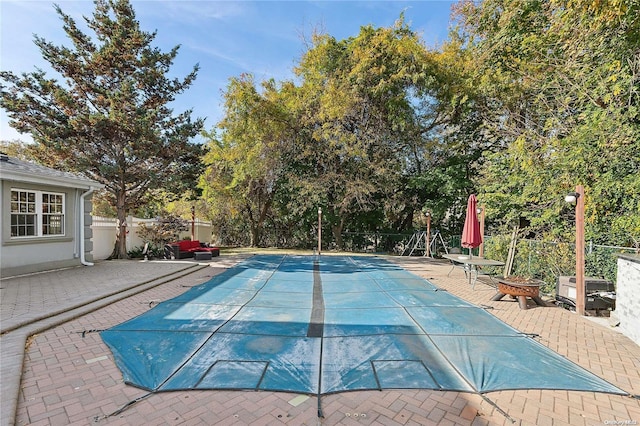 view of swimming pool featuring a patio