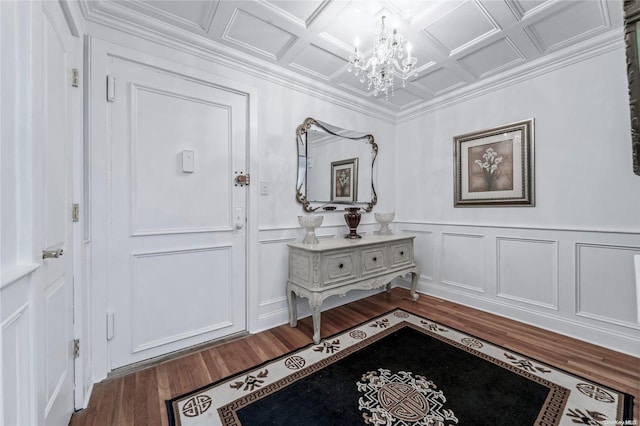 entrance foyer featuring a chandelier, hardwood / wood-style floors, and coffered ceiling