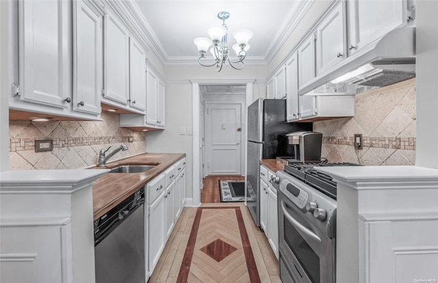 kitchen with white cabinets, stainless steel appliances, an inviting chandelier, and sink