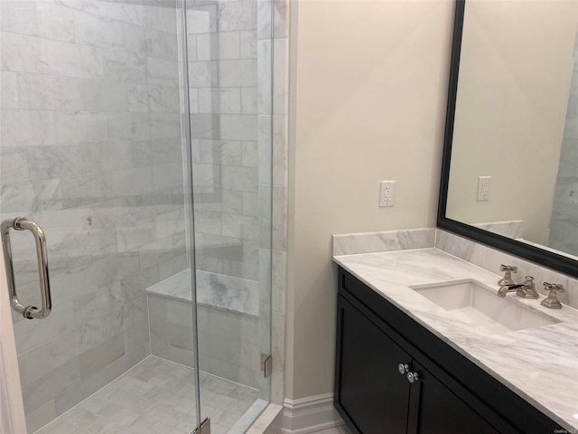 bathroom with vanity and an enclosed shower