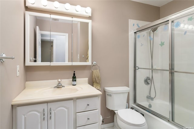 full bathroom with vanity, toilet, and enclosed tub / shower combo