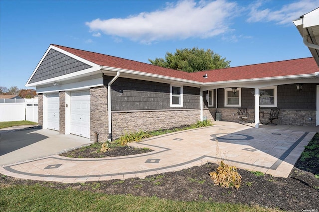 view of side of home featuring a garage