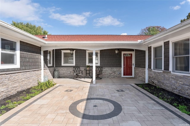 property entrance featuring a porch