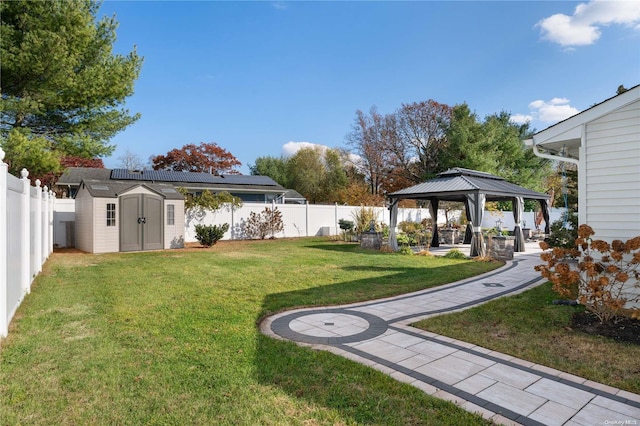 view of yard with a gazebo and a storage unit