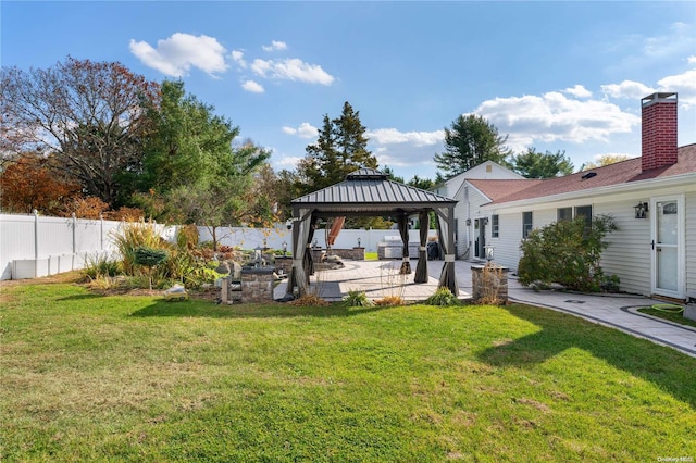 view of yard featuring a gazebo and a patio area