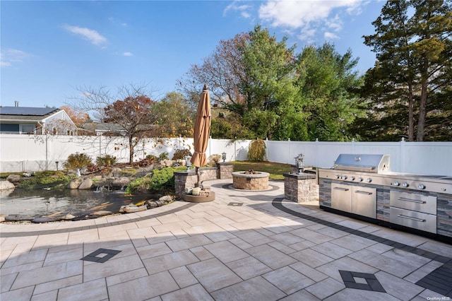 view of patio with an outdoor kitchen