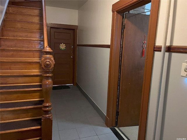 hall featuring tile patterned flooring