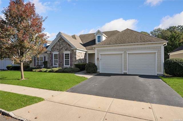 view of front of house featuring a front yard and a garage