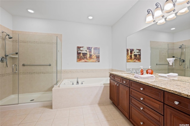 bathroom with tile patterned flooring, vanity, and plus walk in shower