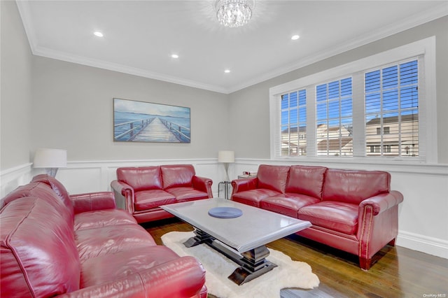 living room featuring crown molding, dark hardwood / wood-style flooring, and a notable chandelier