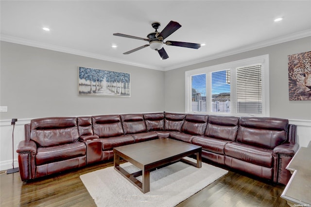 living room with crown molding, ceiling fan, and dark hardwood / wood-style floors