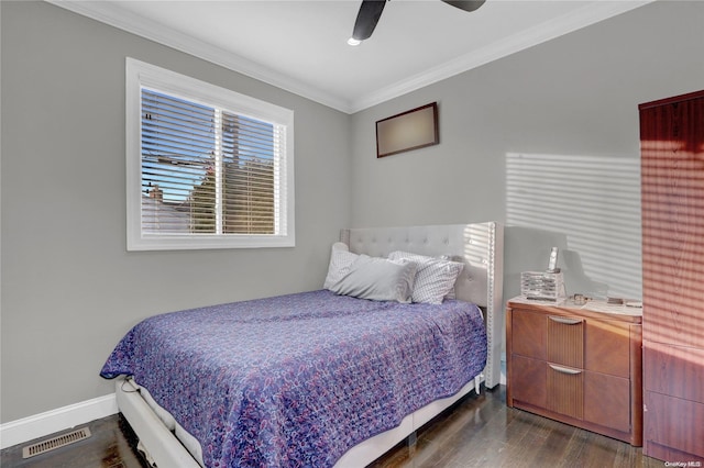 bedroom with ceiling fan, crown molding, and dark hardwood / wood-style floors