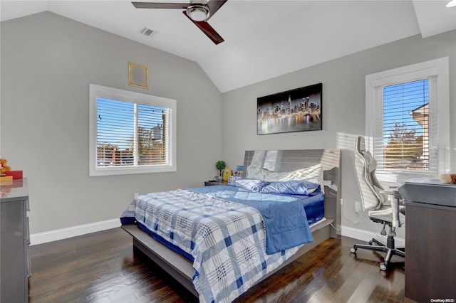 bedroom with ceiling fan, lofted ceiling, dark wood-type flooring, and multiple windows