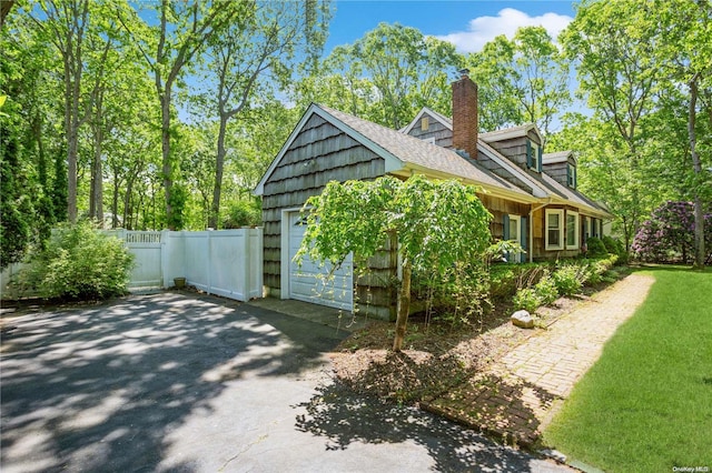 view of side of home with a garage