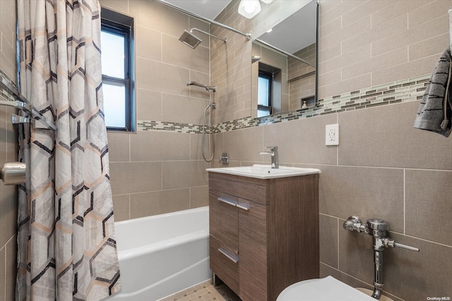 full bathroom with shower / tub combo, vanity, toilet, and tile walls