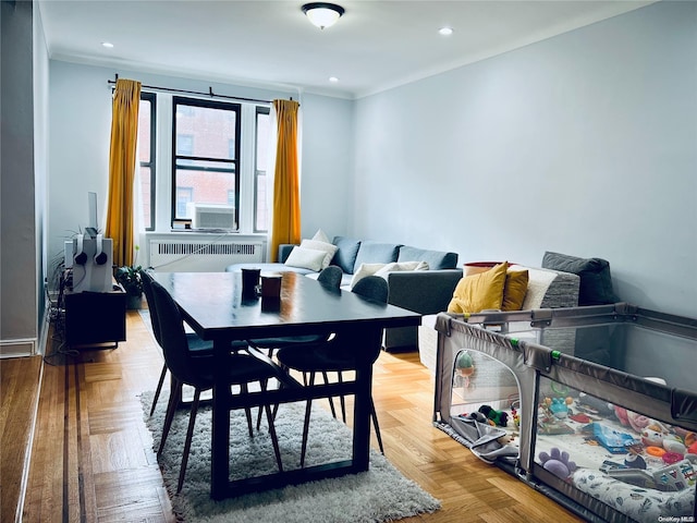 dining space with radiator heating unit and parquet floors