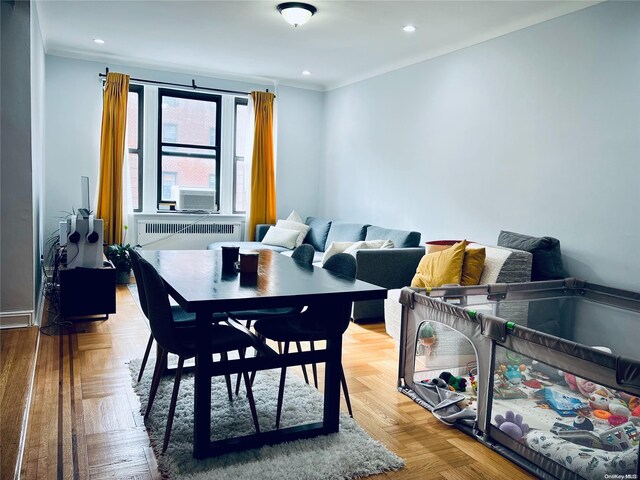80-09 35th Ave Unit C16, Jackson Heights, NY 11372 - dining space featuring radiator heating unit, crown molding, and recessed lighting
