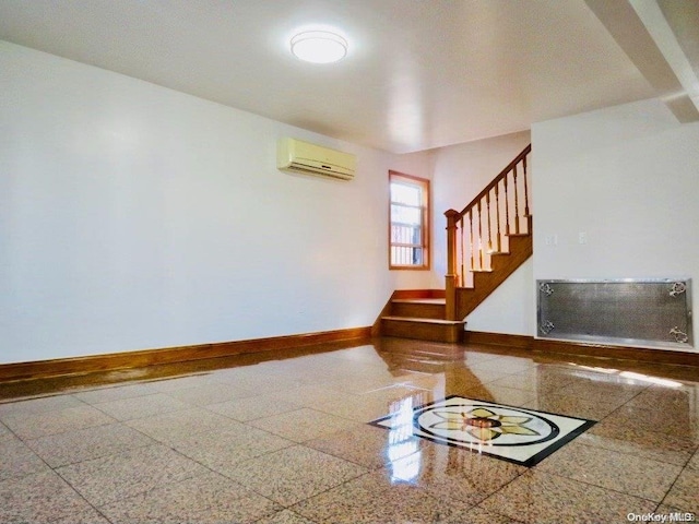 empty room with a wall mounted air conditioner and radiator