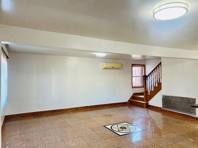 basement featuring a wall mounted air conditioner