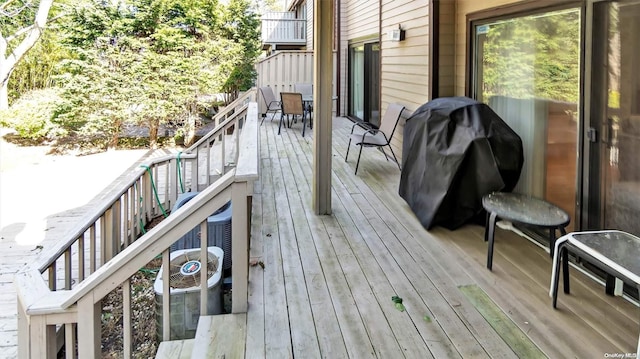 wooden terrace featuring grilling area