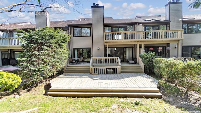 back of house with a wooden deck