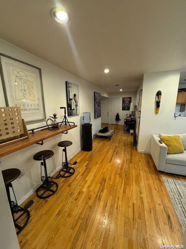 interior space with recessed lighting, light wood-style flooring, and baseboards