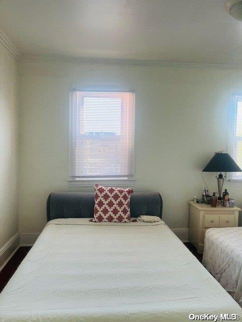 bedroom featuring ornamental molding