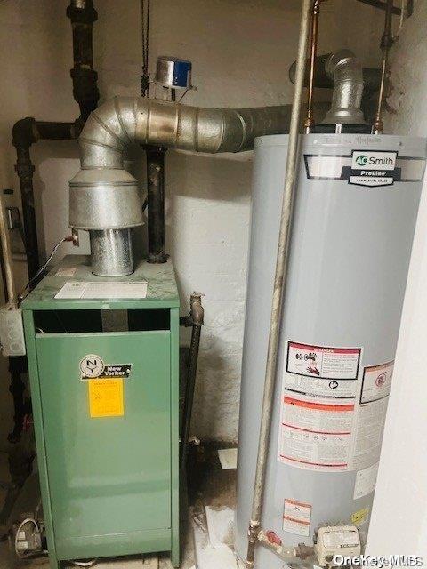 utility room featuring water heater