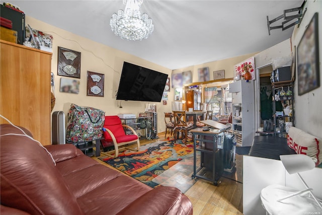 living room featuring a chandelier and hardwood / wood-style flooring