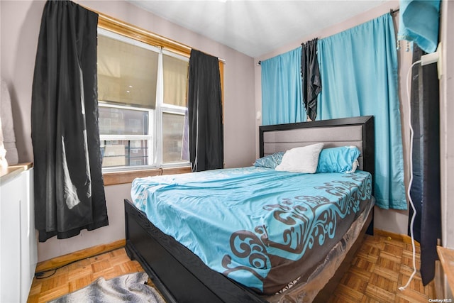 bedroom featuring parquet floors