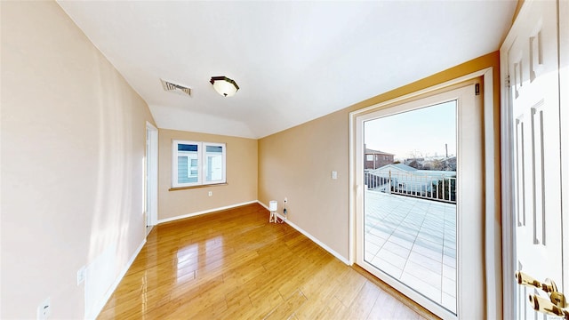 unfurnished room featuring hardwood / wood-style floors