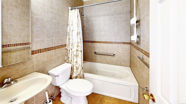 full bathroom with toilet, tile walls, tile patterned floors, sink, and shower / tub combo with curtain