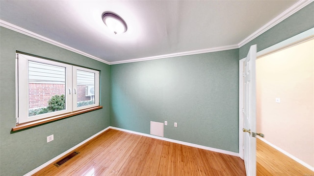 unfurnished bedroom featuring ornamental molding and hardwood / wood-style floors