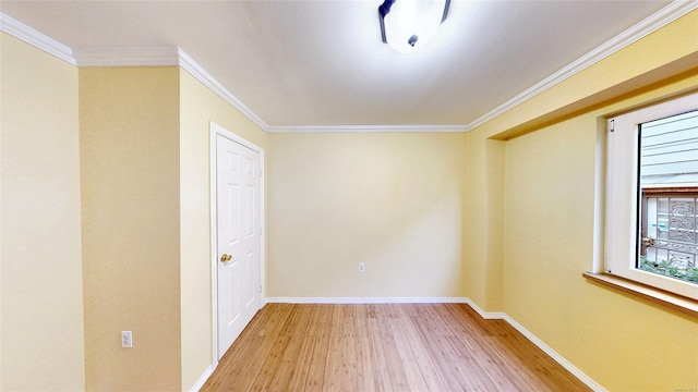 unfurnished room featuring crown molding and light hardwood / wood-style flooring