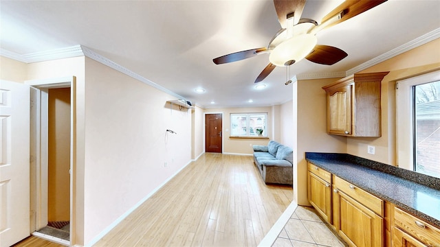 interior space featuring ornamental molding and light hardwood / wood-style floors