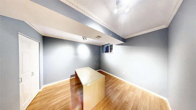 additional living space with light hardwood / wood-style flooring