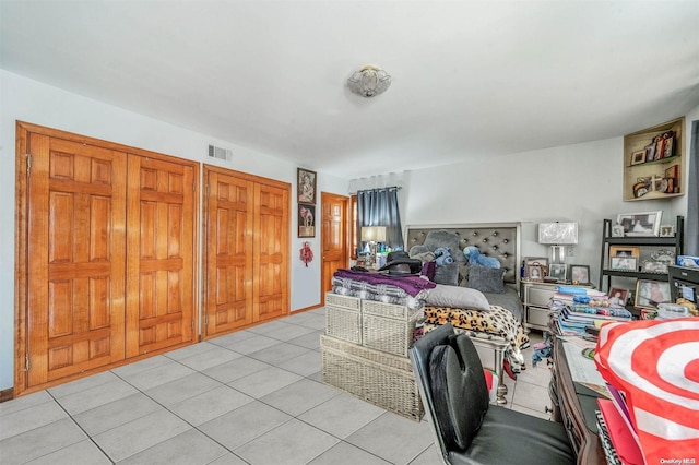 bedroom featuring light tile patterned flooring