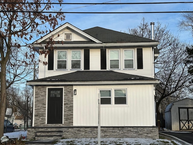 front of property with a storage shed