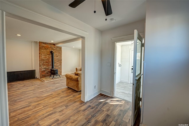 hallway with beamed ceiling and wood-type flooring