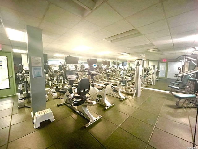 exercise room with a drop ceiling