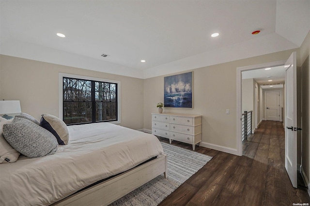 bedroom featuring dark hardwood / wood-style flooring