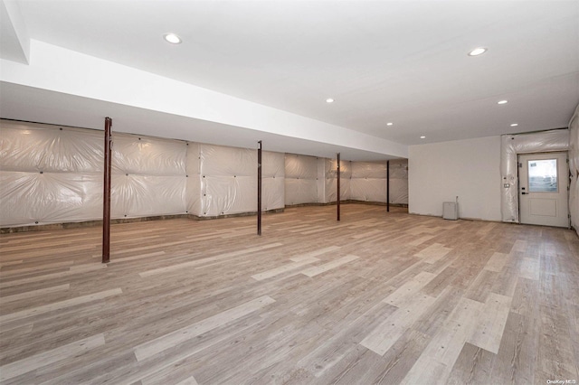 basement featuring light wood-type flooring