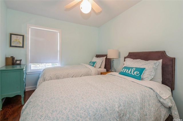 bedroom featuring ceiling fan and dark wood-type flooring