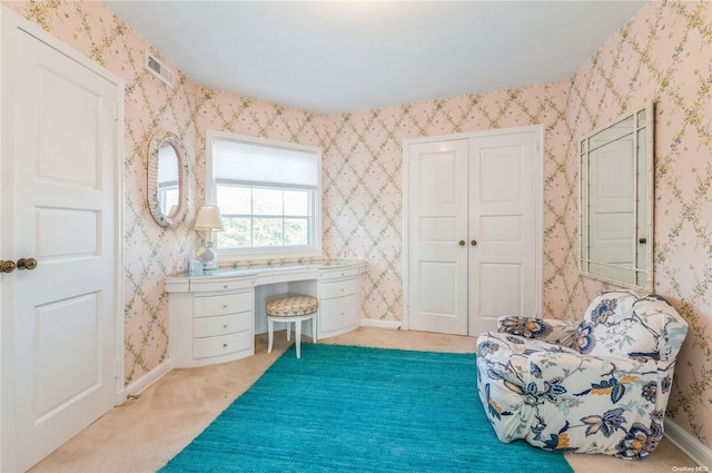 living area featuring light colored carpet