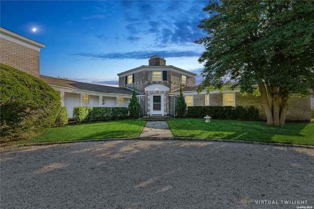 view of front of property with a lawn